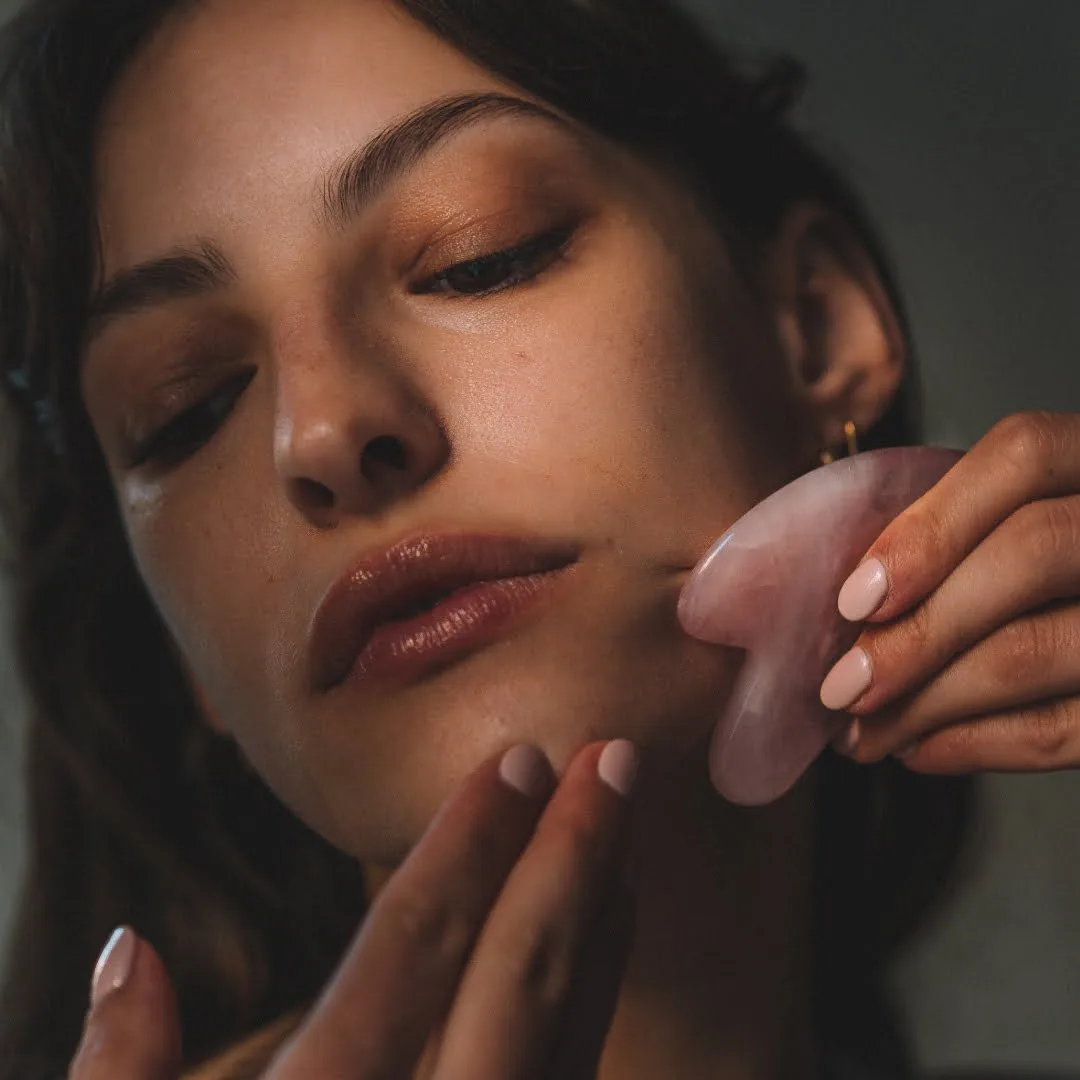 Massage with a rose quartz gua sha